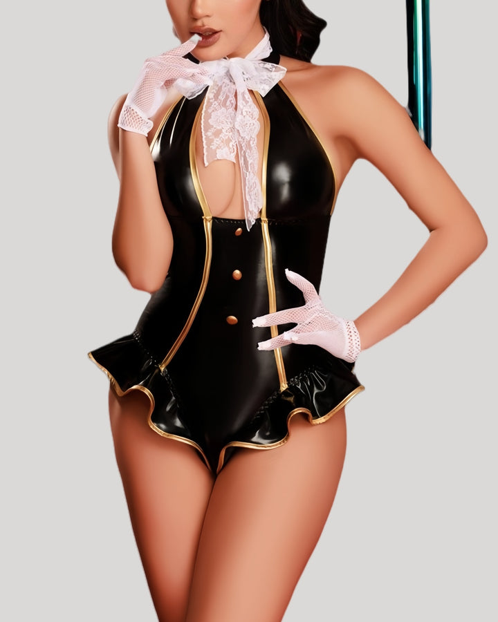 Model in black and gold flight attendant bodysuit with lace bow and hat, front view