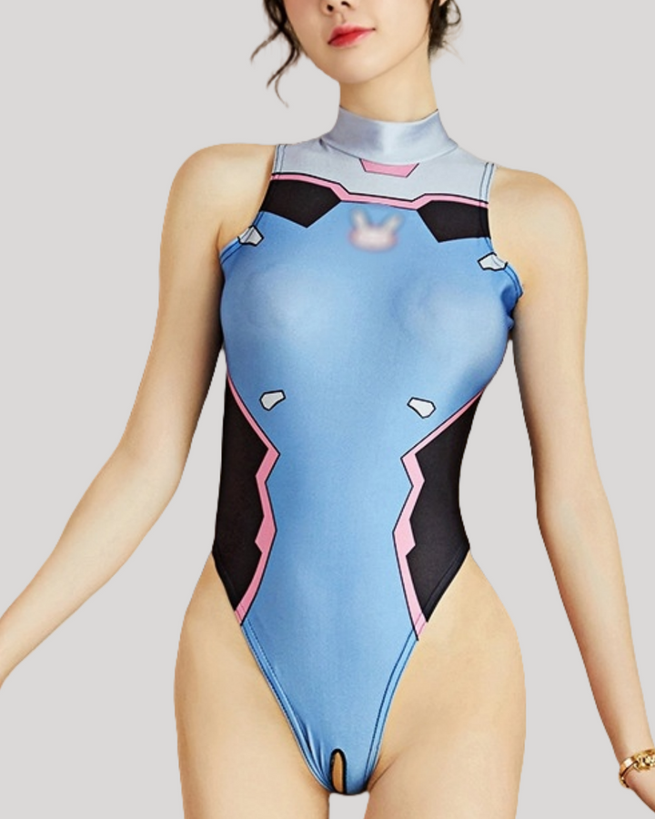 Person wearing a blue and black swimsuit with pink accents on a plain background