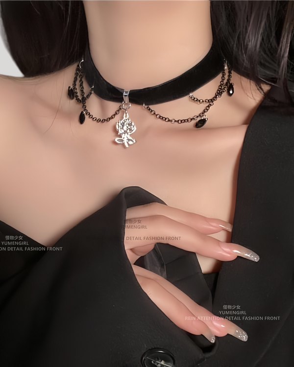 Model wearing velvet choker with camellia flower charm and black waterdrop chains