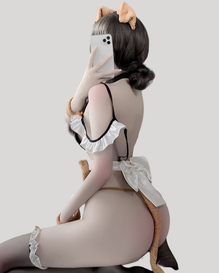 Model wearing lace dog maid costume with paw print apron and bow headband