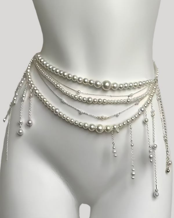 Multi-strand pearl waist chain with draping layers and tassels on mannequin