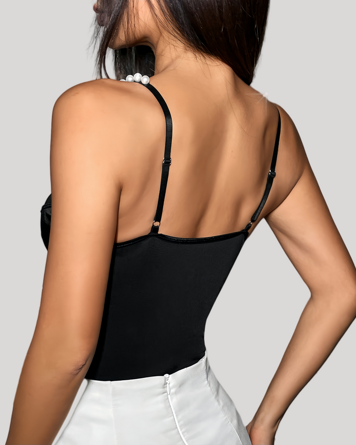 Back view showing adjustable straps and plain black fabric panel