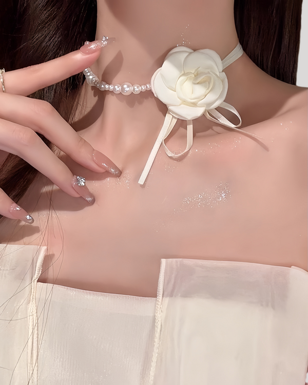 Model wearing white Petal Grace Pearl Choker with pearl and flower detail