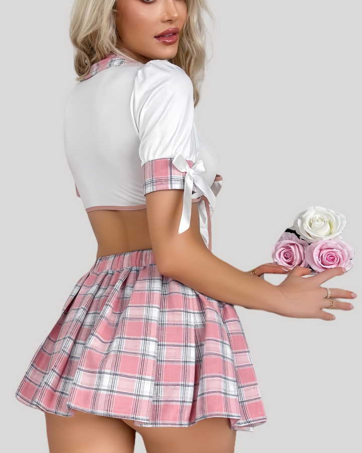 Side profile of elastic-waist pleated mini skirt with detachable satin side bows