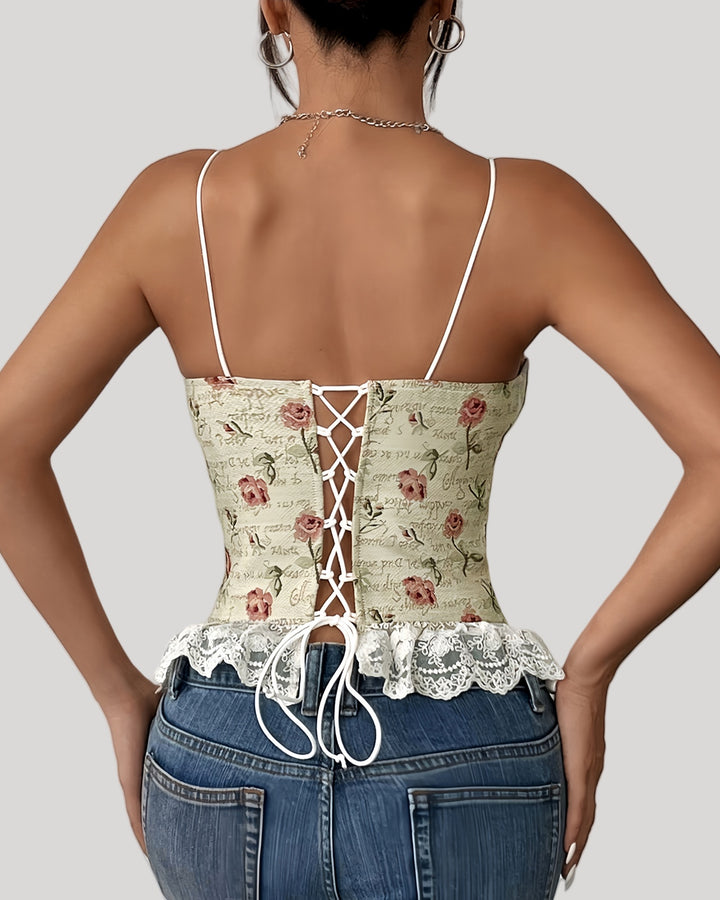 Back view of lace-up floral jacquard corset with lace hem and ribbon detail