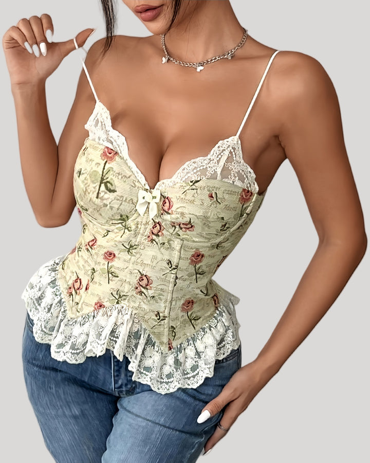 Woman wearing floral jacquard corset top with lace trim and bow accent