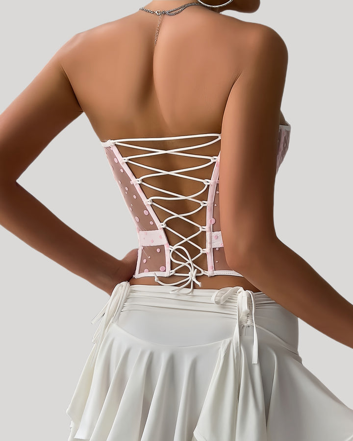 Back view of pink lace-up corset with adjustable ribbon tie
