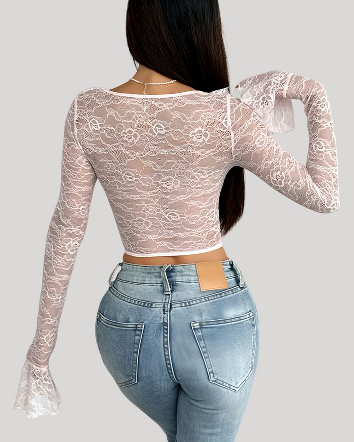 Back view of pink lace bustier showing sheer floral pattern