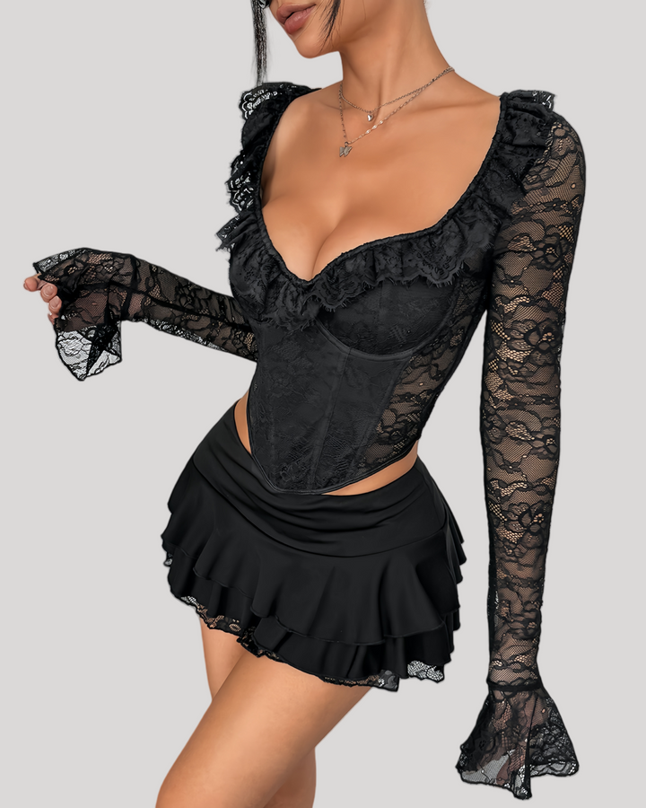Close-up of black lace bustier top with sweetheart neckline and ruffled trim