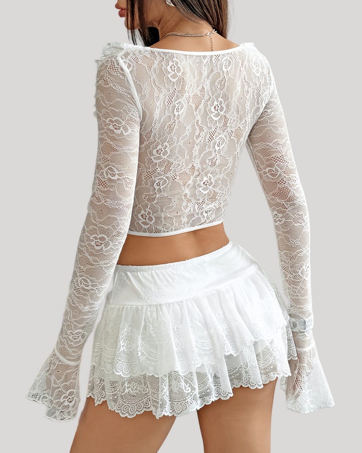 Back view of white lace bustier showing sheer floral pattern