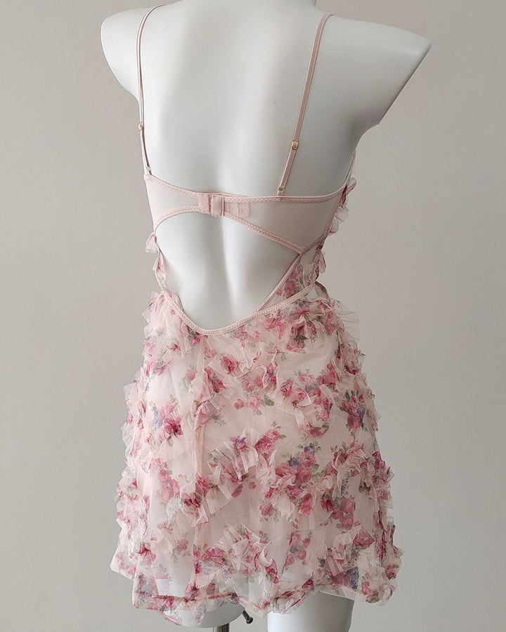 Back view highlighting open-back cutout and adjustable straps.
