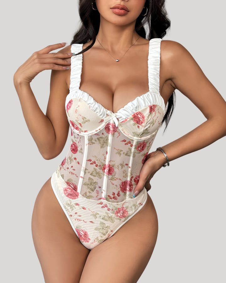 Front view of model wearing rose print mesh bustier with ruched straps