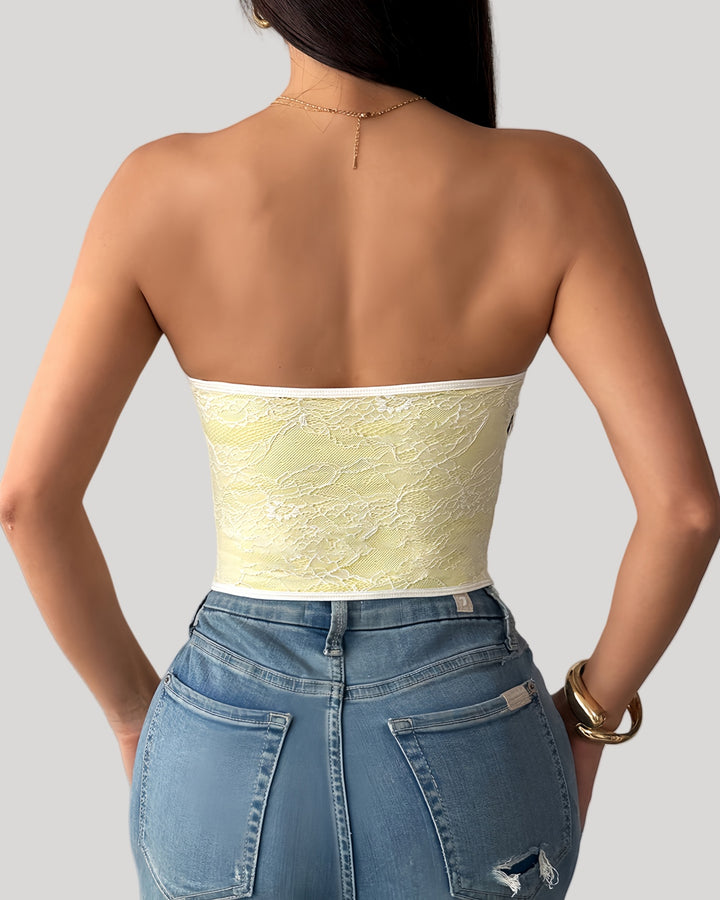 Back view of sheer yellow lace bustier top