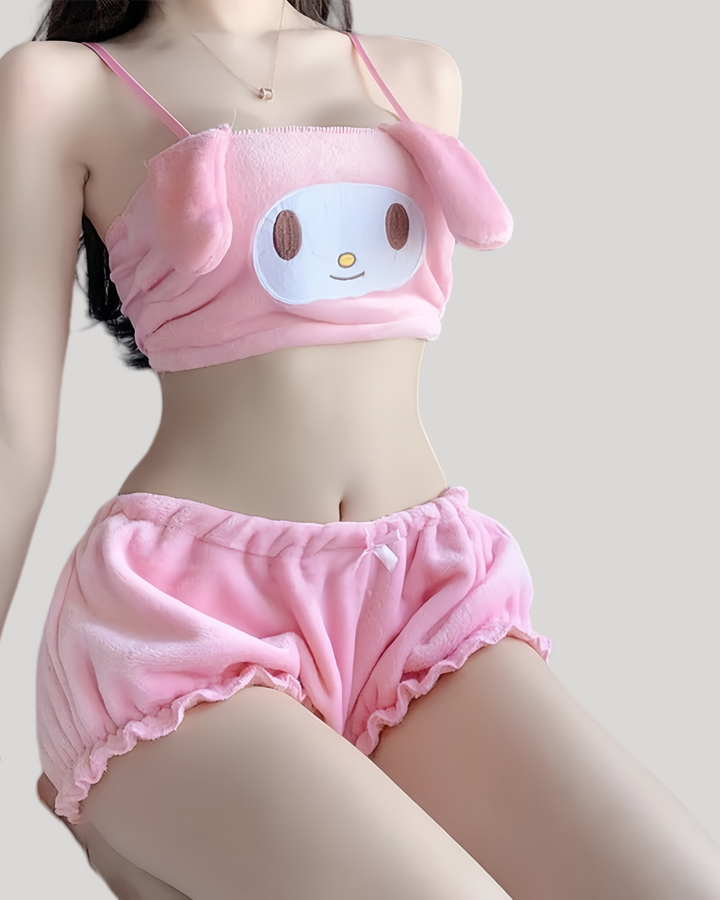 Model in pink My Melody plush tube top with floppy bunny ears and embroidered face, styled with matching pink ruffled elastic shorts tied with a bow