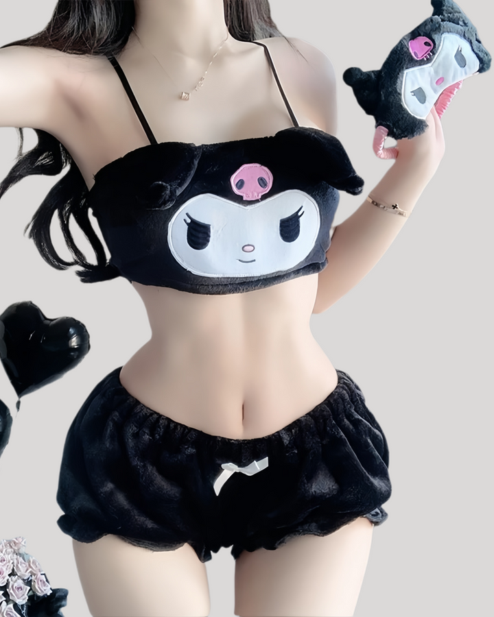 Person wearing black Kuromi plush bandeau top with skull-decorated ears and embroidered face, matched with black fuzzy ruffle shorts and a small satin bow