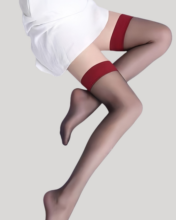 Model wearing sheer black thigh-high stockings with red top bands