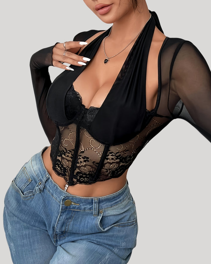 Front view of model wearing sheer lace halter long sleeve top with jeans