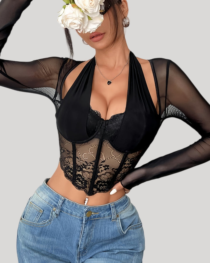 Front view of model wearing sheer lace halter long sleeve top with jeans
