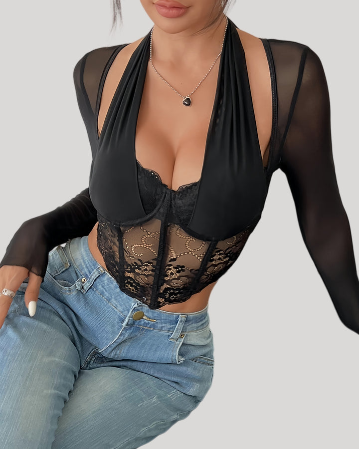 Front view of model wearing sheer lace halter long sleeve top with jeans