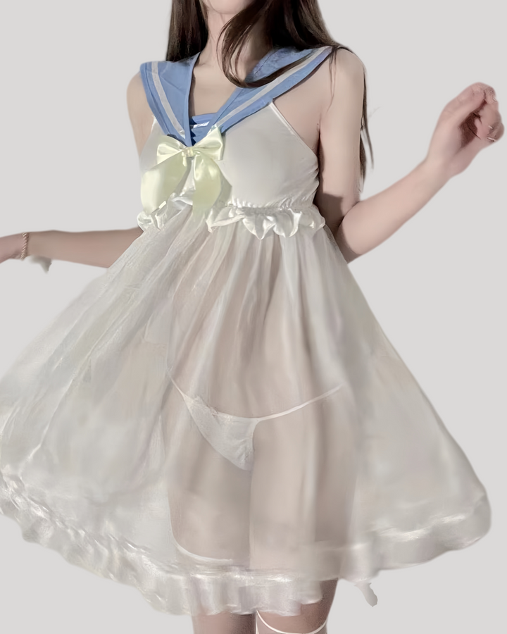 Model wearing sheer ivory babydoll dress with powder-blue sailor collar and satin bow