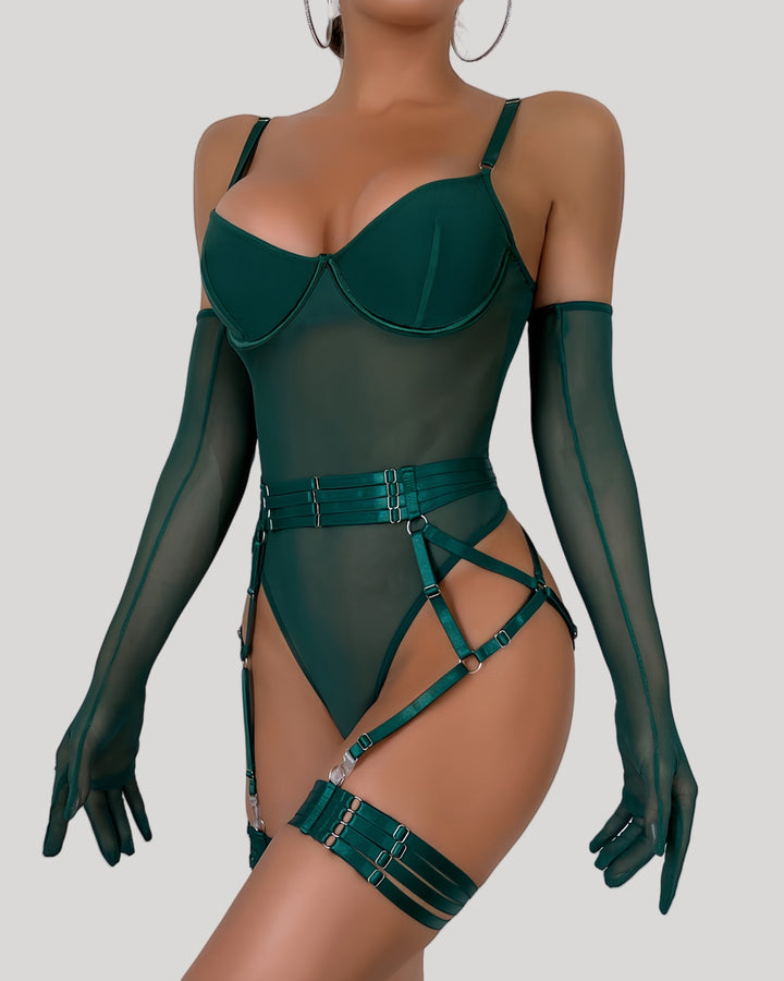 Front view of model wearing green mesh and velvet strap bodysuit with matching gloves