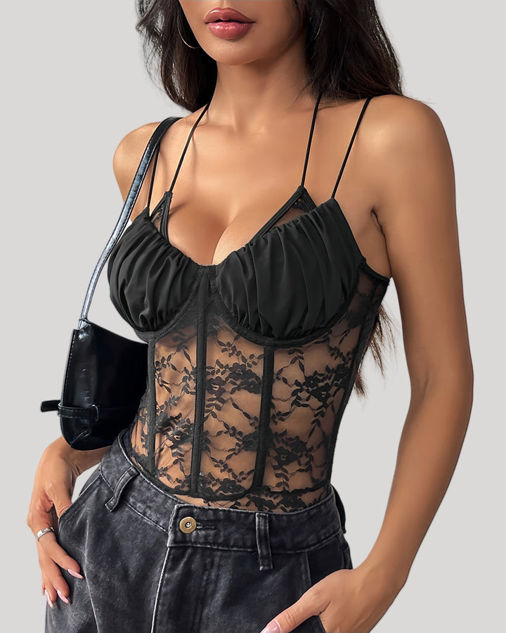 Model wearing a sheer lace bodysuit with pleated cups