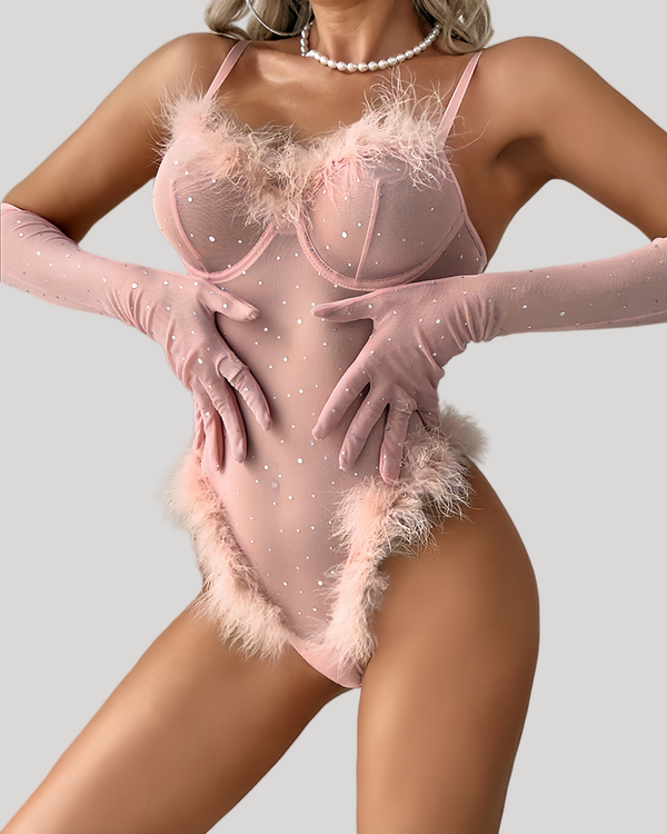 Front view of sheer bodysuit with pink feather trim and sparkling rhinestones