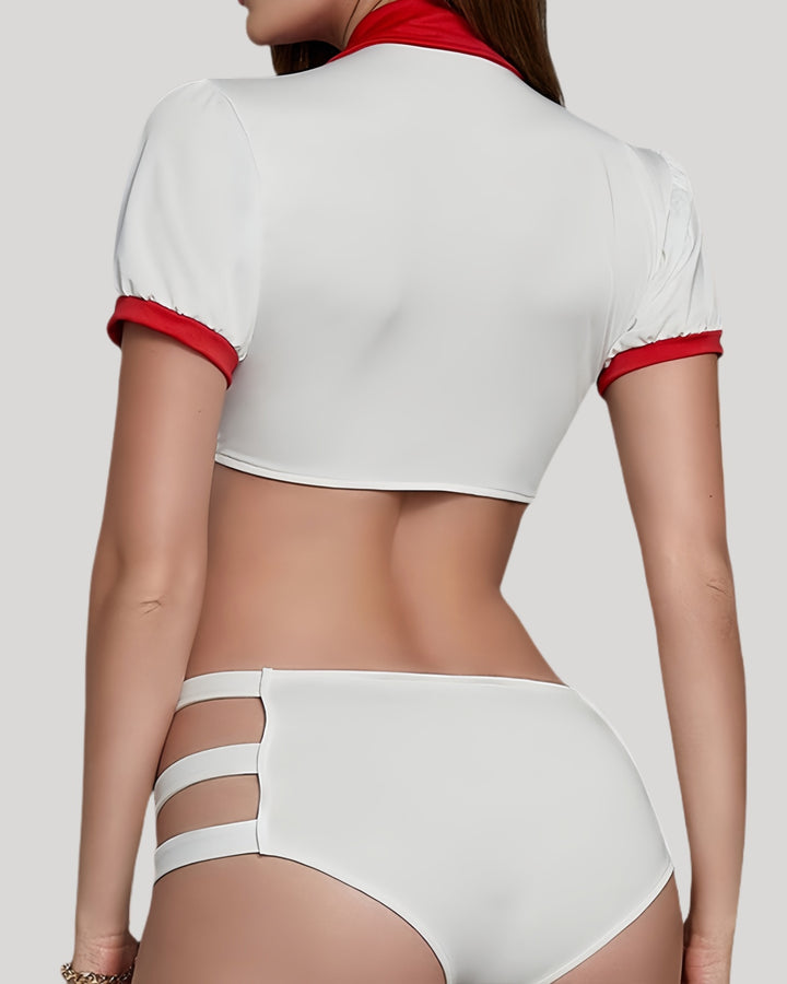 Back view of white nurse costume showing crop top and hip strap details