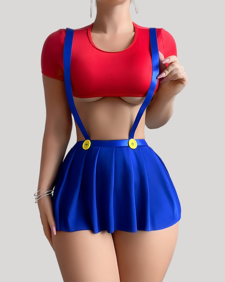 model wearing a red underbust crop top and blue pleated mini skirt with yellow button suspenders