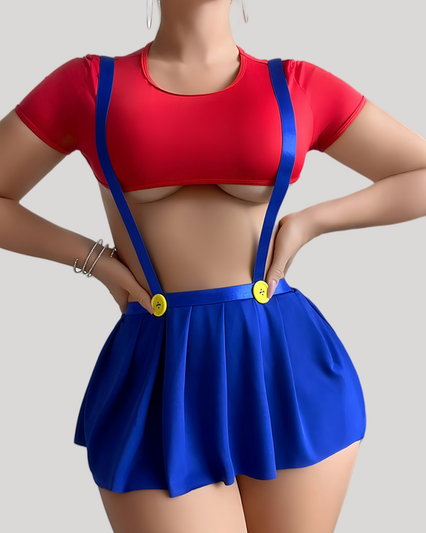 model wearing a red underbust crop top and blue pleated mini skirt with yellow button suspenders