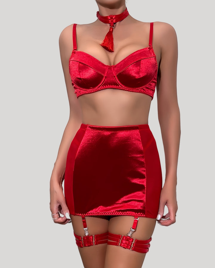 Model wearing red satin bra and mini skirt set with tassel choker