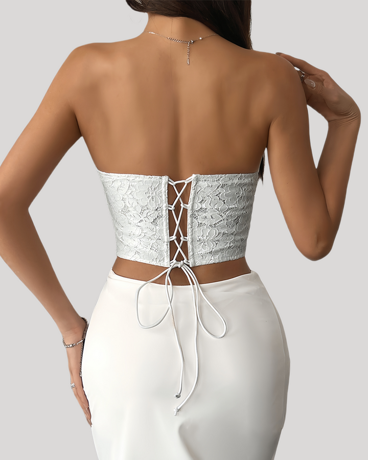 Back view of white lace bustier with criss-cross lace-up closure