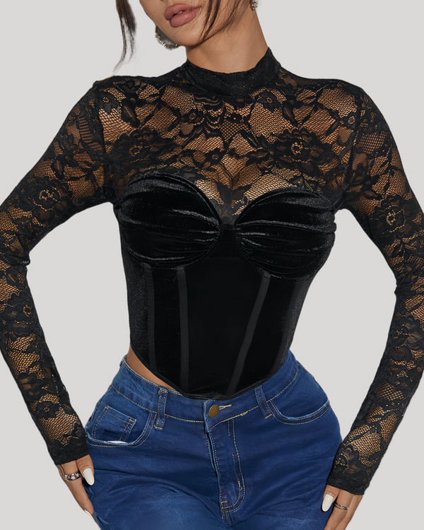 Model wearing black velvet lace long sleeve bustier top with jeans