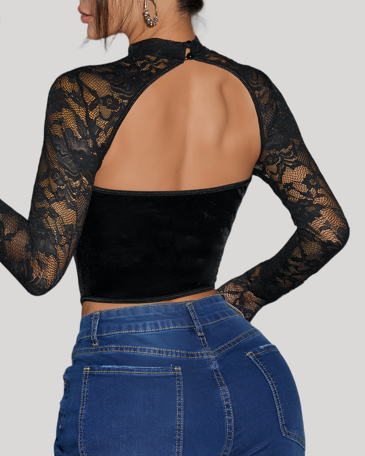 Back view of open cut-out and velvet panel in long sleeve lace top