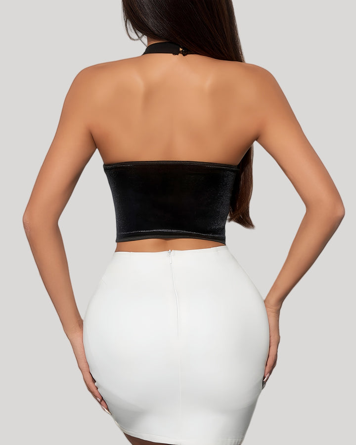 Back view of black velvet halter bustier with open back and smocked band