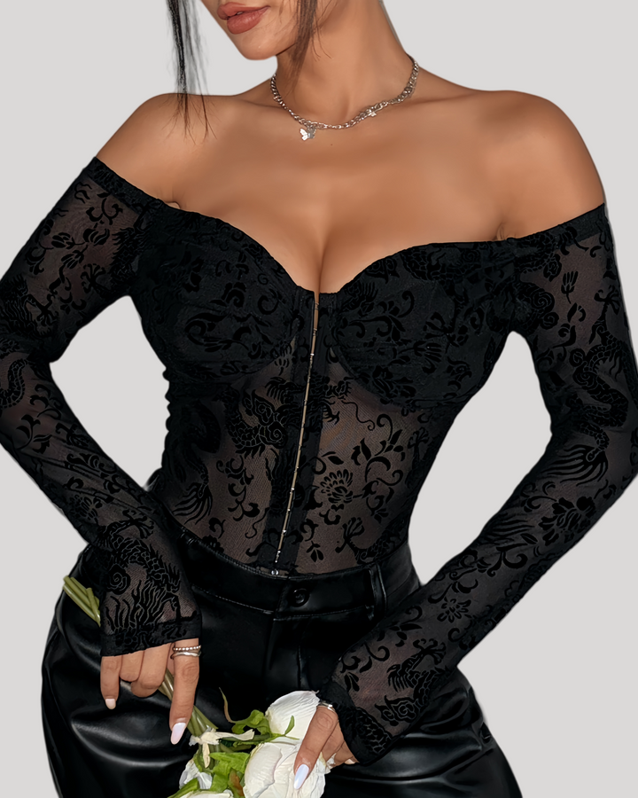 Close-up of hook front closure and velvet dragon pattern mesh bodice