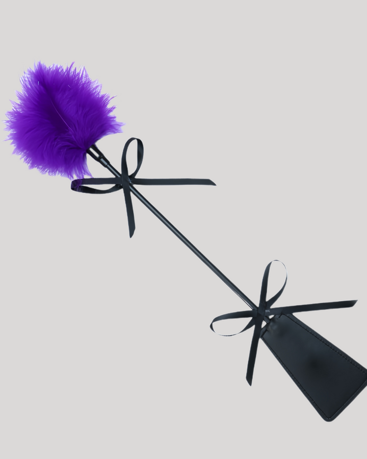 Purple feather teaser with leather paddle base