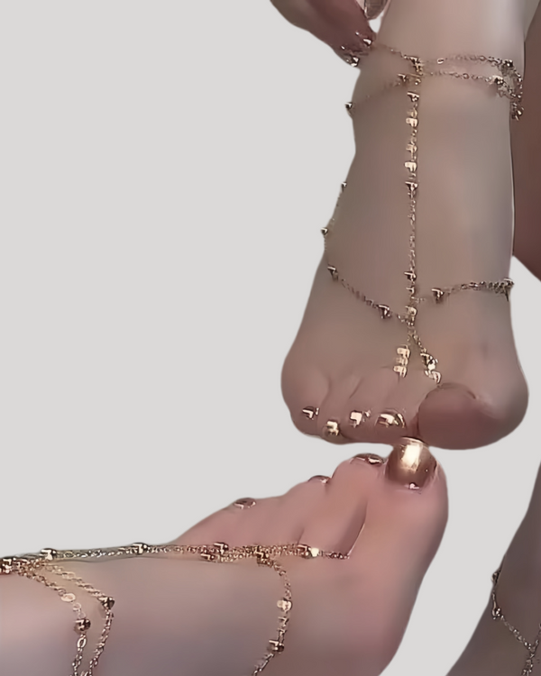 Gold barefoot foot jewelry with layered chains and coins